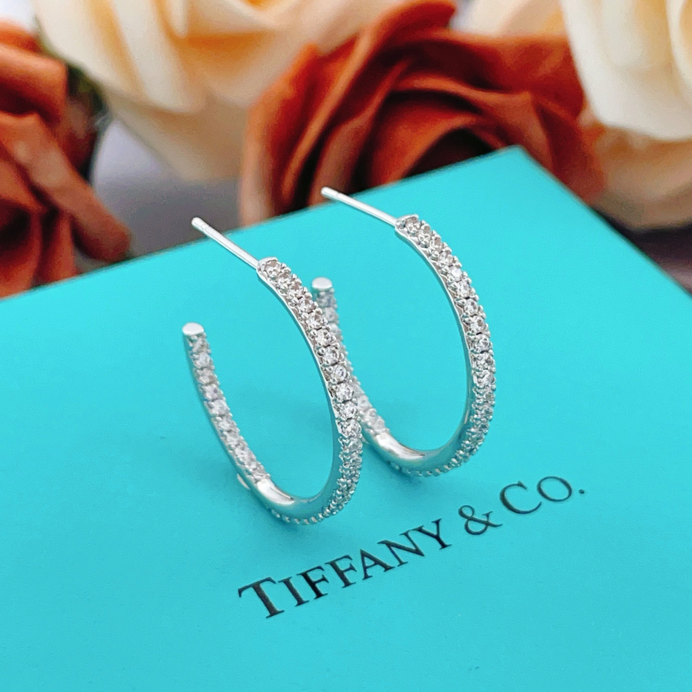 Tiffany & Co. Silver diamond-encrusted semi-circular earrings